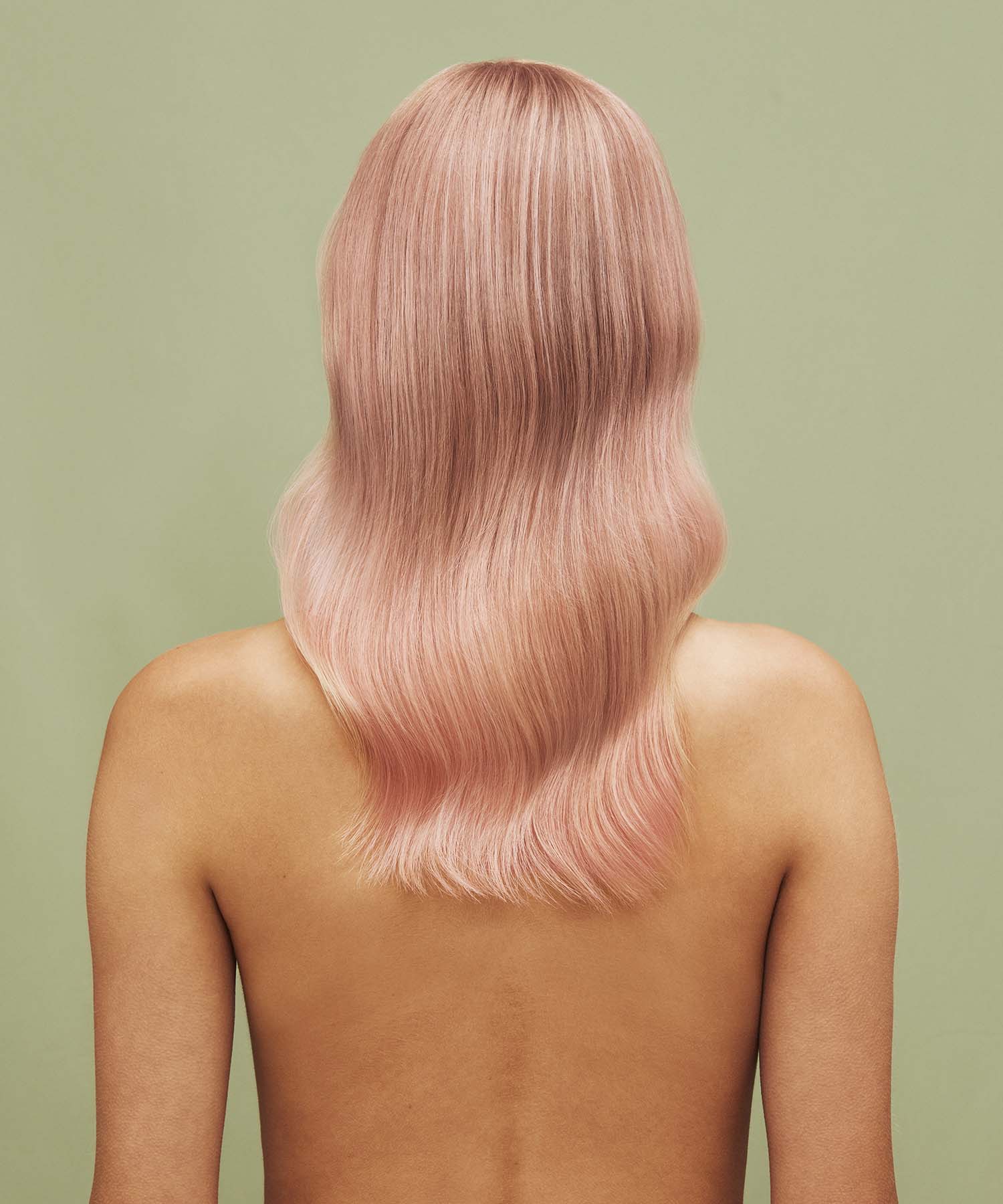 Result on hair after using Color Refresh against a green background